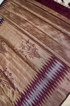 Tissue Silk Saree with Ikat-Inspired Weaving & Floral Buta – Antique Gold & Wine
